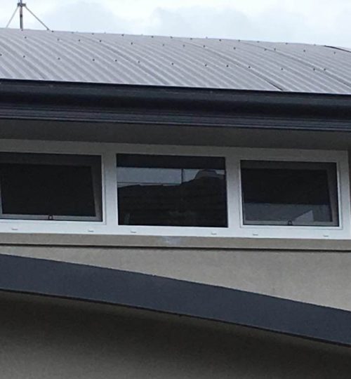 A window on the roof of a house.