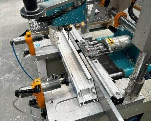 A machine is being used to make a piece of metal. A machine is being used to make a piece of metal.