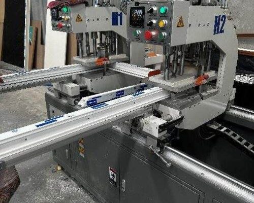 A machine is being used to cut a piece of wood. A machine is being used to cut a piece of wood.
