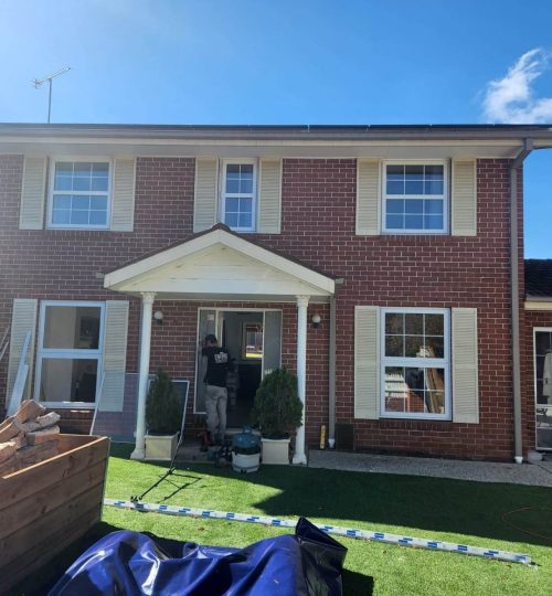 UPVC Casement & Awning Windows 1 A house with UPVC casement windows and an awning.